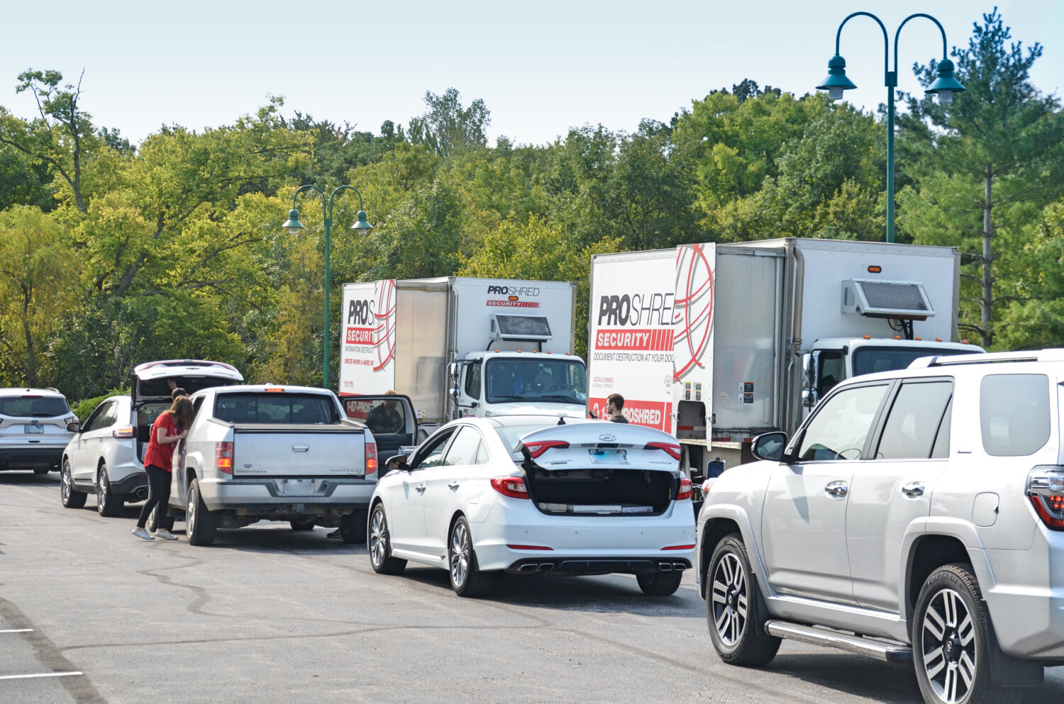 Cars in line at 2019 Shred Day in Leawood Office parking lot.