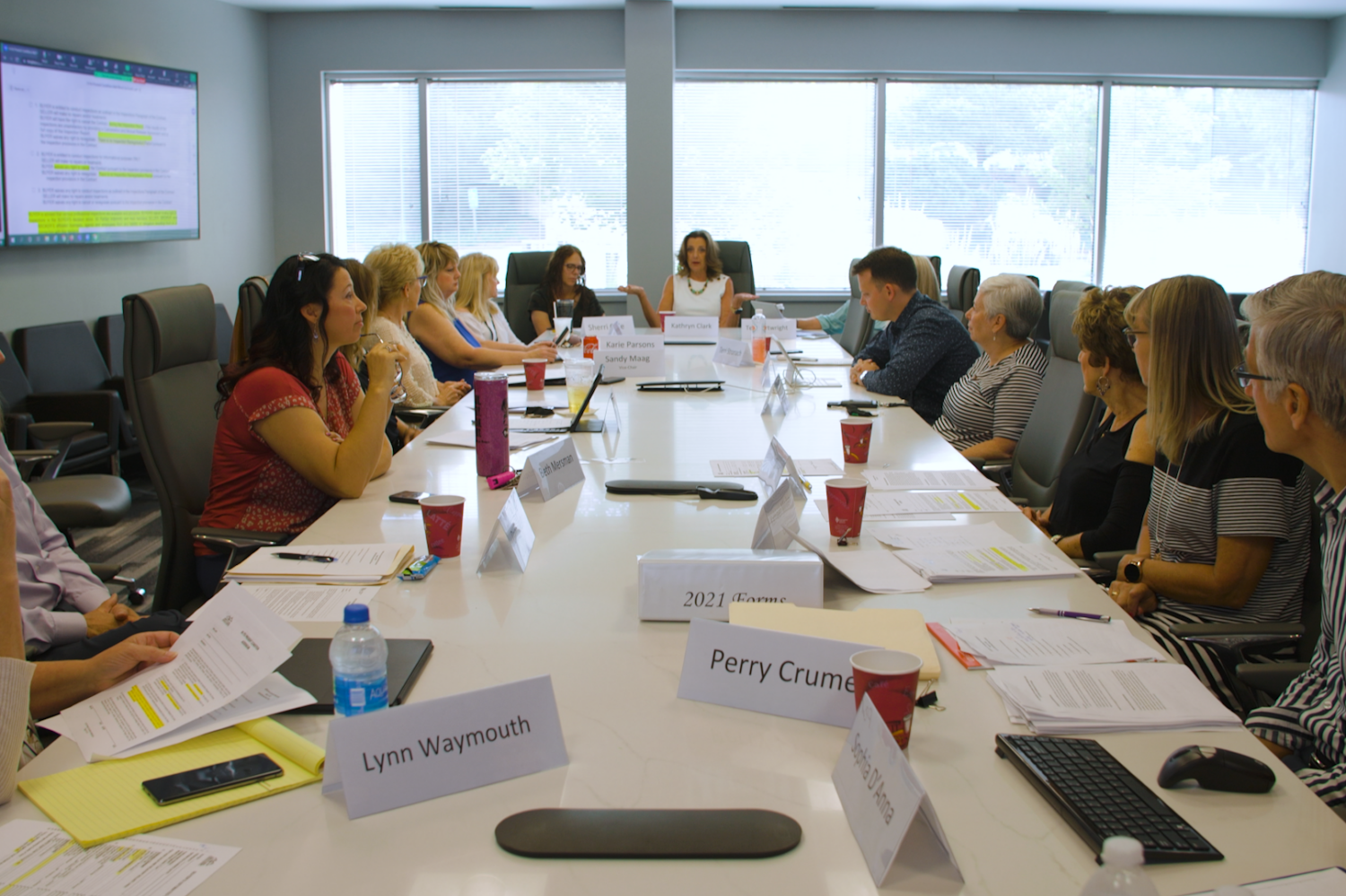 Image description: The KCRAR Forms Committee sits around the table in the newly updated boardroom.