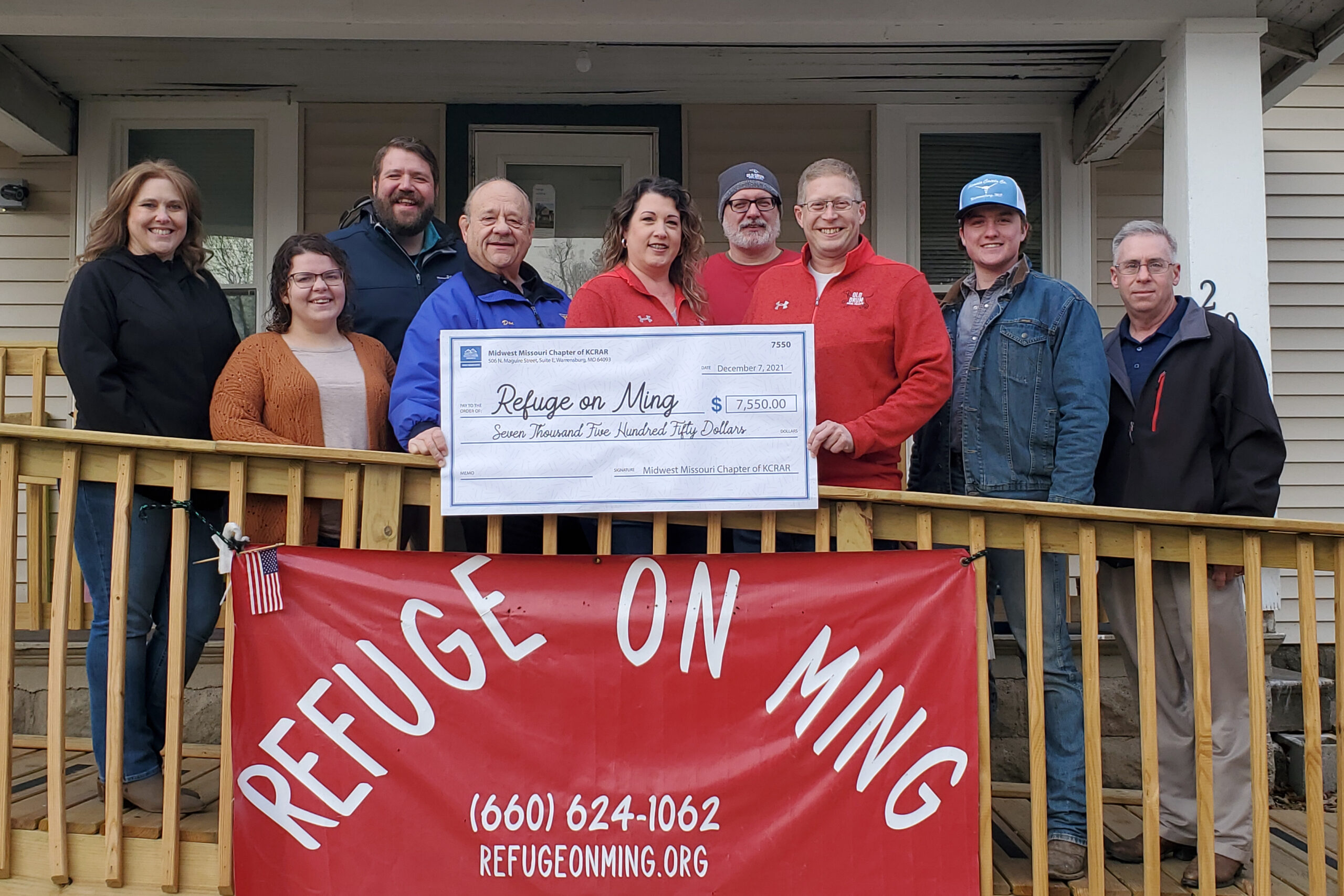 Image description: Members of the Midwest Missouri Chapter present Refuge on Ming with a donation check of $7,550.