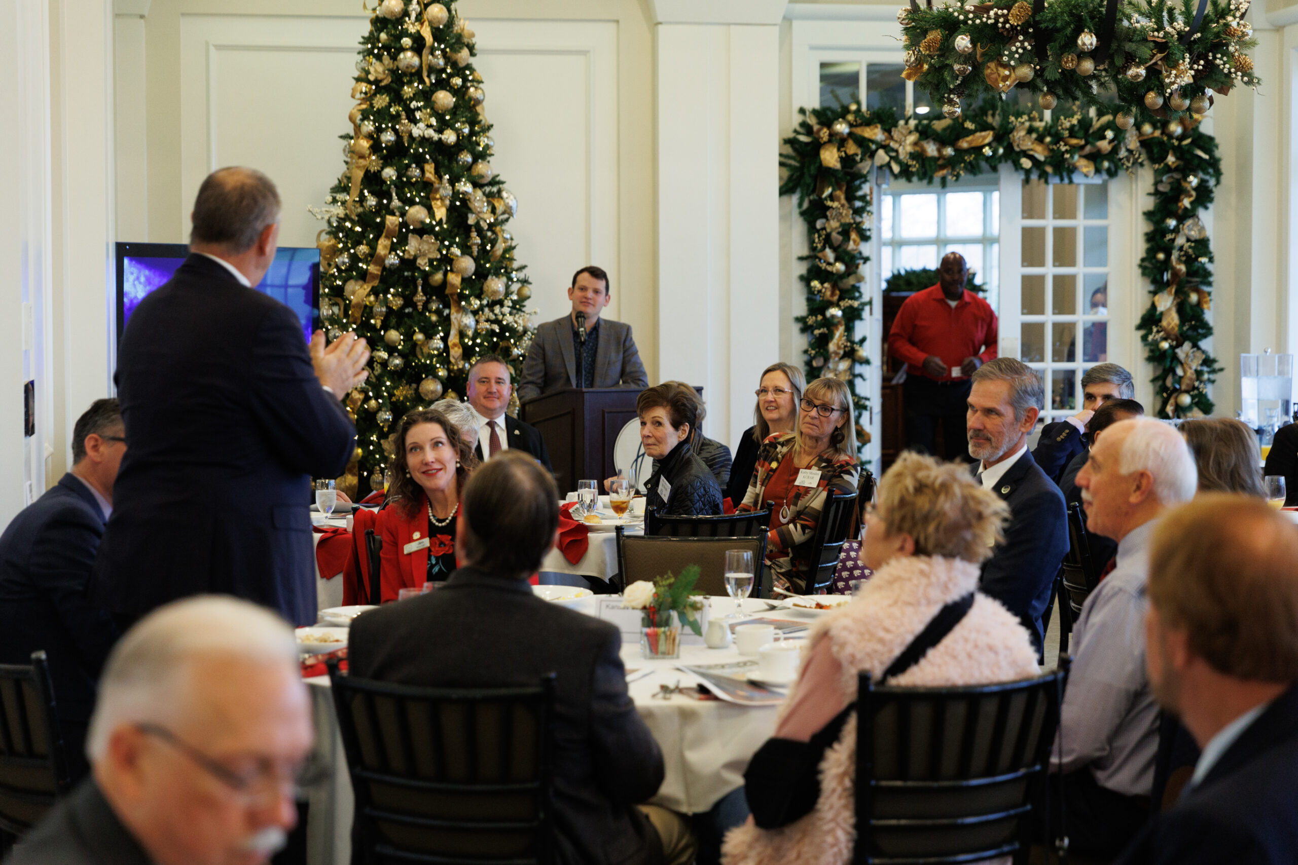 Image description: REALTORS meet with Kansas Legislatures and breakfast meeting.